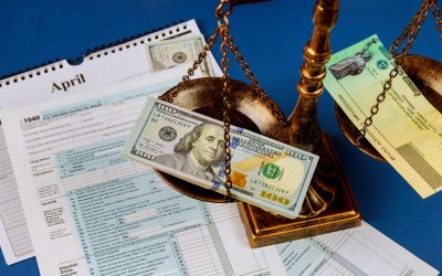 Individual Income Return Tax Law scales of justice criminal liability for non-payment of taxes of one hundred dollars bill form 1040 on U.S.